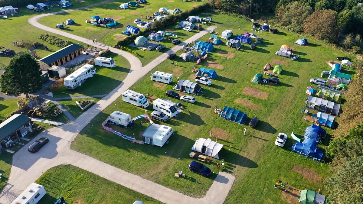 campsite top view with tents and caravans in site